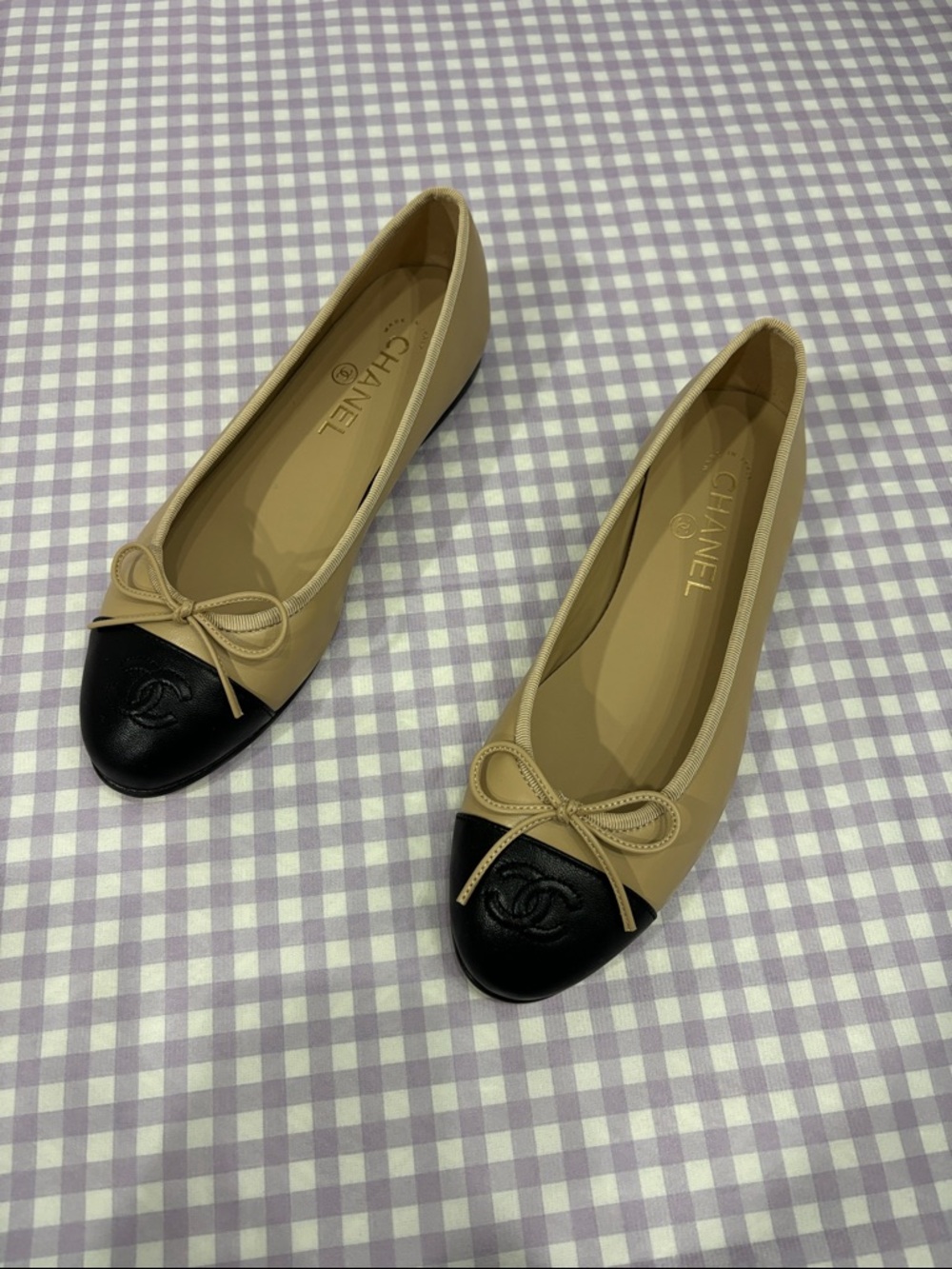 CHANEL Two-Tone Beige and Black Signature Cap-Toe Ballet Flats